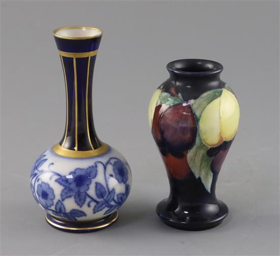 A small Moorcroft wisteria pattern vase and a Macintyre bottle vase